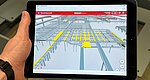 The image shows a view of the FlowMate software on a tablet.